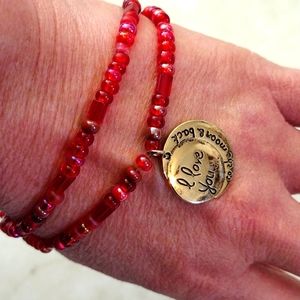 Beautiful double strand beads bracelet with charm.